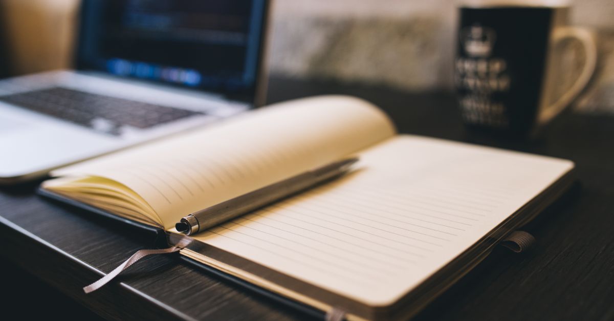 Notebook and pen used to track Clickworker earnings per hour in India