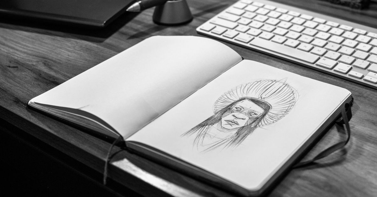 Notebook beside a keyboard, practising clear written English for online work in India