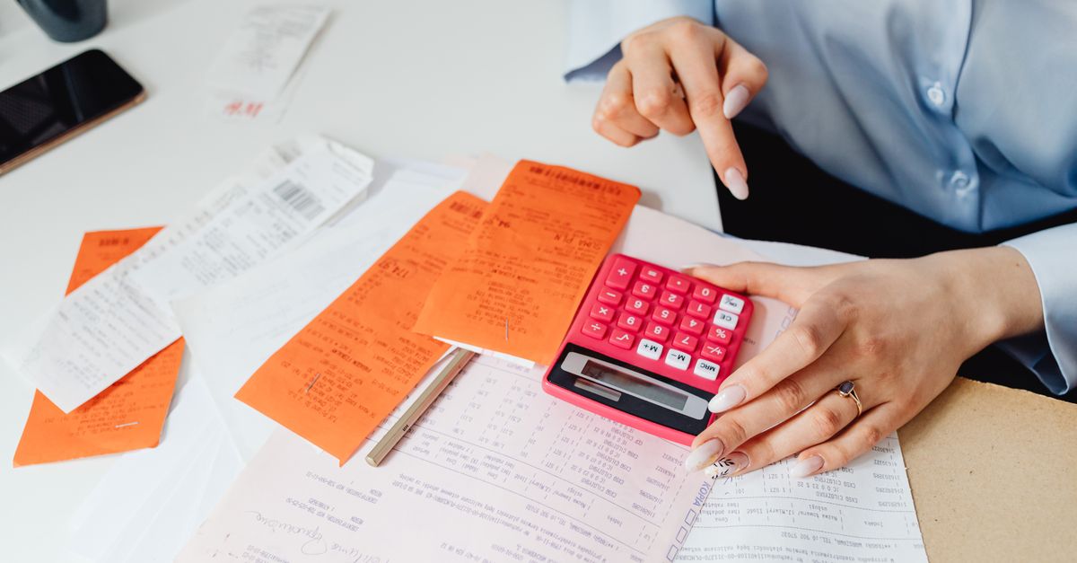 Calculator and receipts used to work out real PayPal, Payoneer and Wise fees on a payment to India