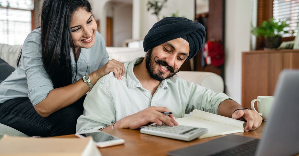 Indian freelancers at home working out income tax on online earnings