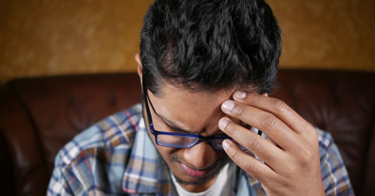 Indian man realising he has lost money to a Telegram prepaid task scam