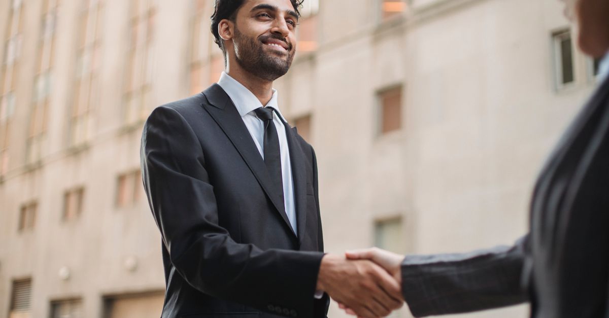 Two men in suits shaking hands outdoors, the diplomacy BRICS Summit 2026 is made of