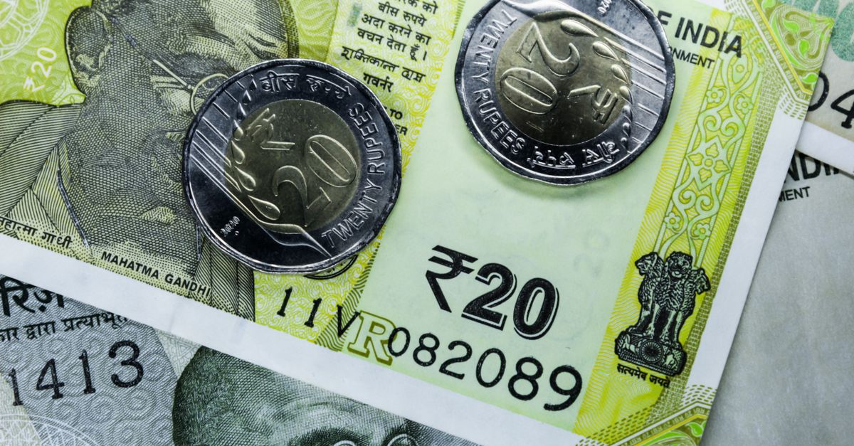 Indian twenty rupee note and coins, close to what an hour of captcha typing returns